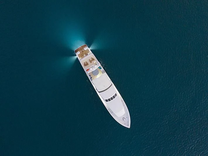 a white and red boat aboard WINNING HAND Yacht for Sale