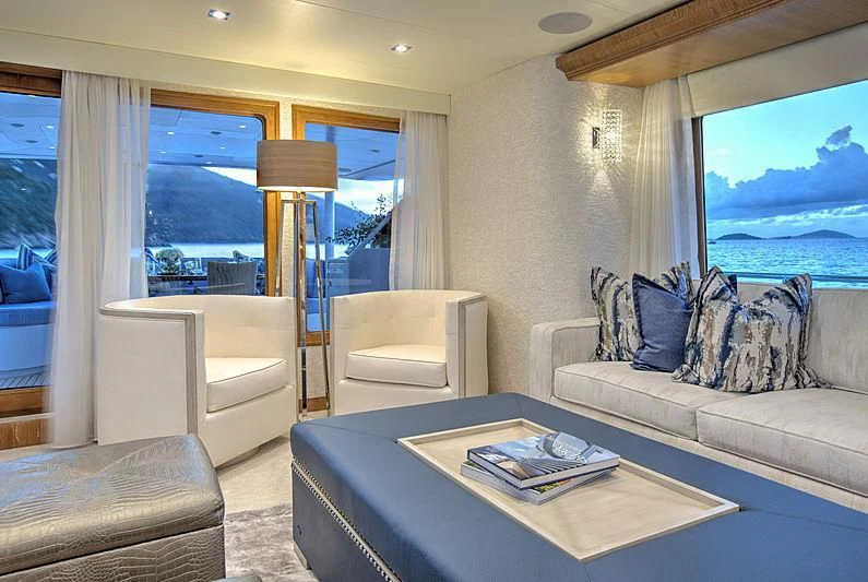 a living room with a large window aboard WINNING HAND Yacht for Sale