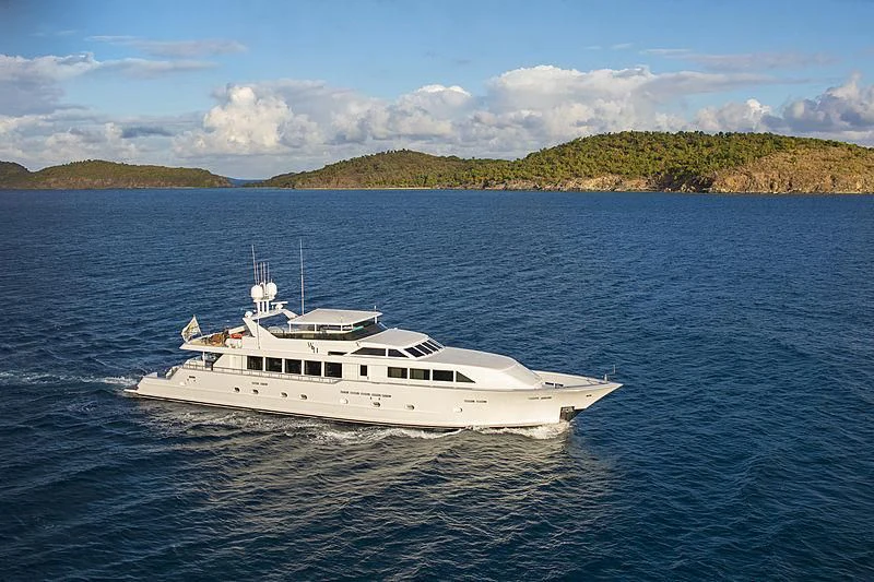 a white boat in the water aboard WINNING HAND Yacht for Sale