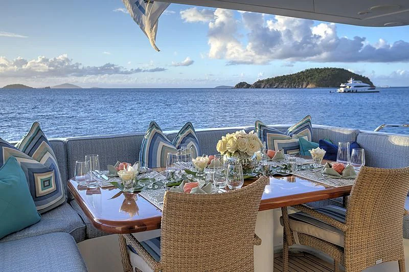 a table set for a meal on a boat aboard WINNING HAND Yacht for Sale