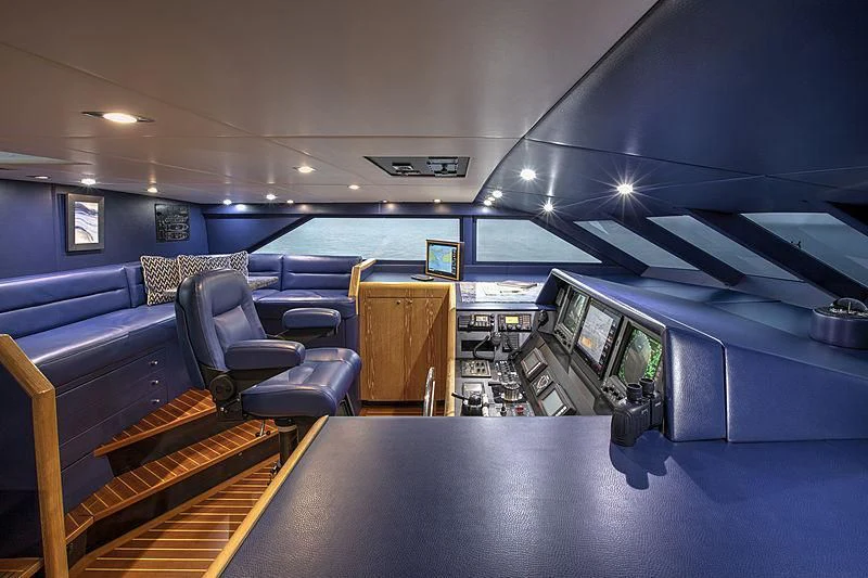 inside of a vehicle with a desk and chairs aboard WINNING HAND Yacht for Sale