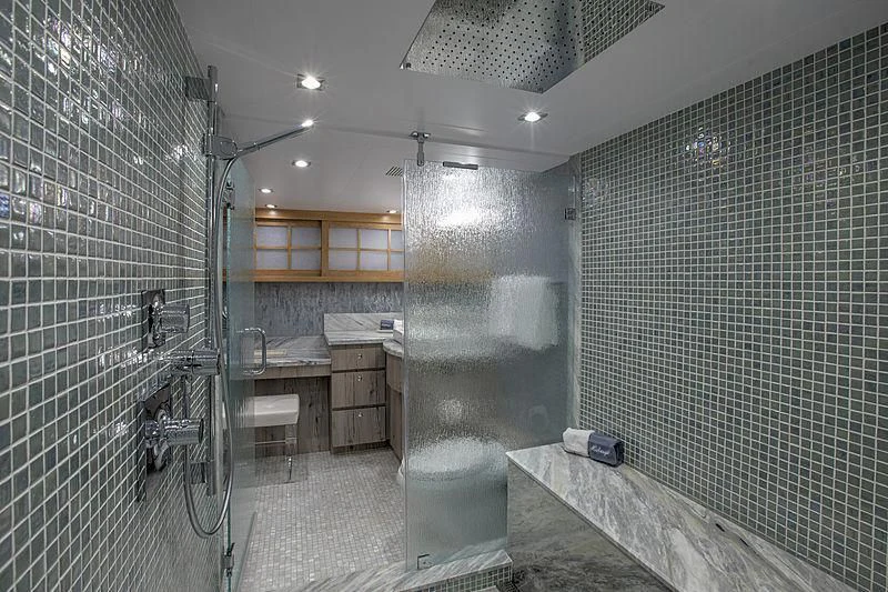 a bathroom with a shower aboard WINNING HAND Yacht for Sale