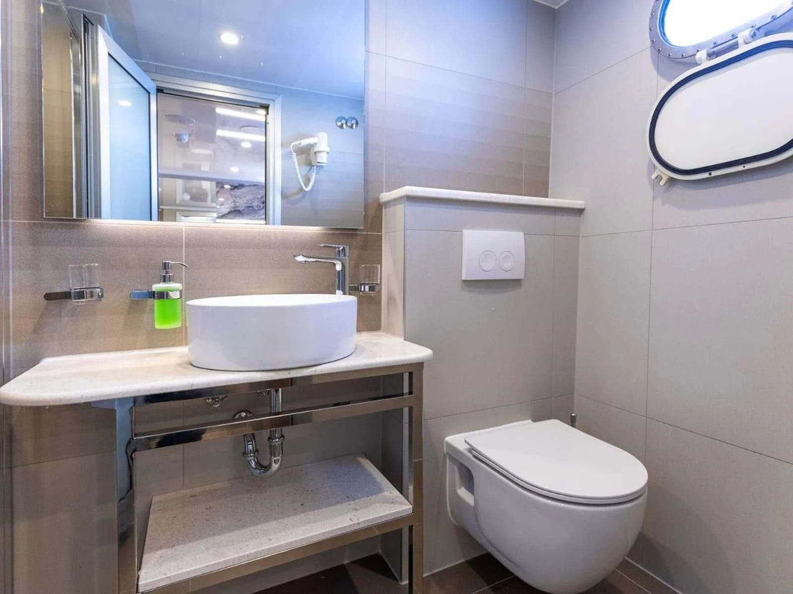 a bathroom with a sink toilet and a mirror aboard FREEDOM Yacht for Sale