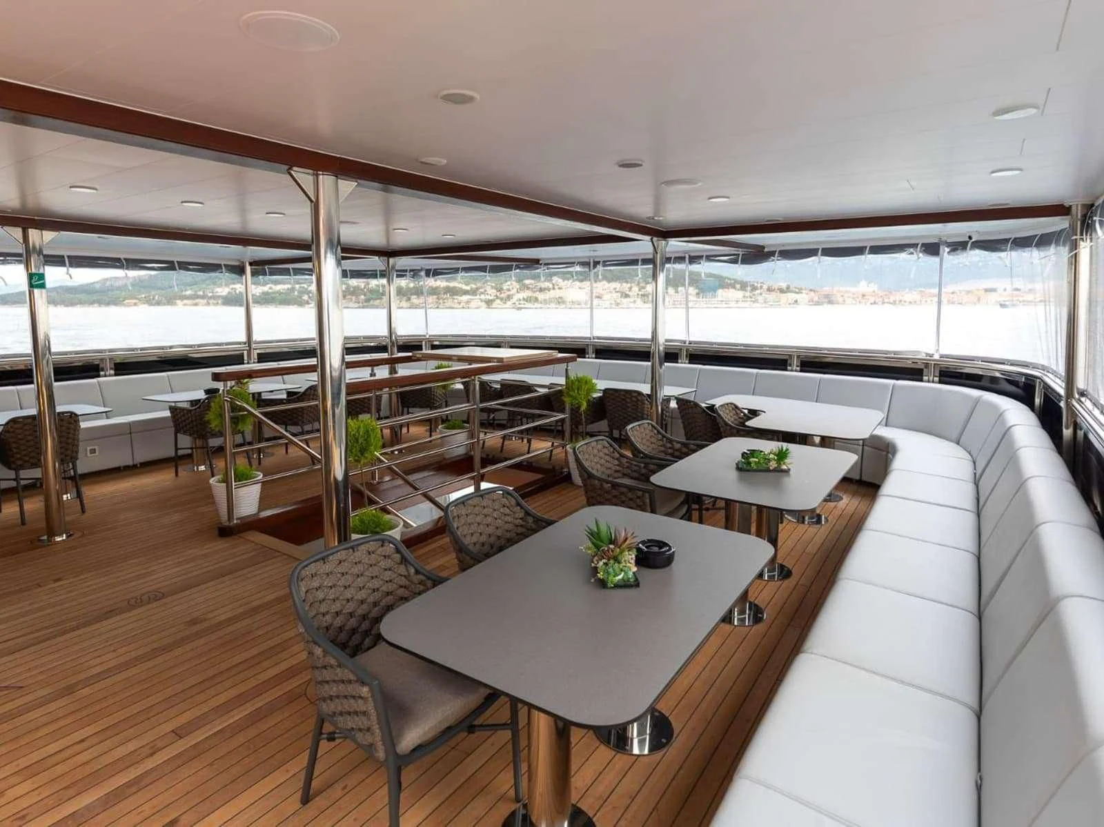 a room with a table and chairs aboard FREEDOM Yacht for Sale
