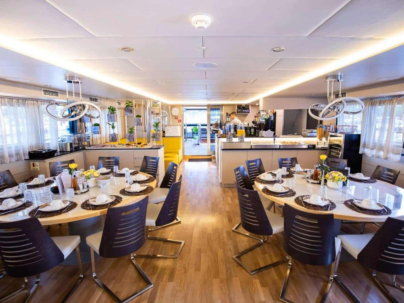 a large kitchen with a dining table aboard FREEDOM Yacht for Sale