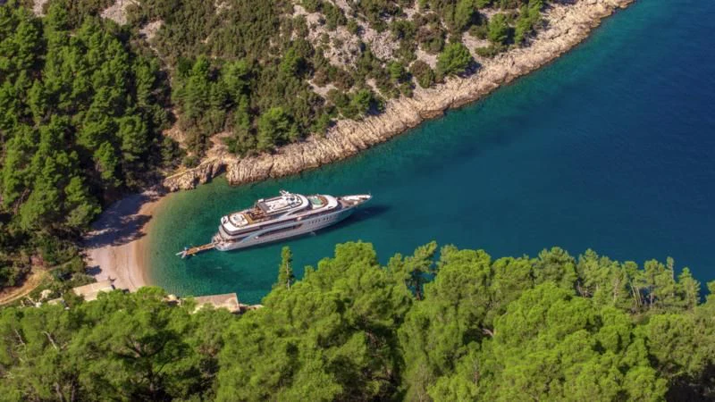a boat on a beach aboard FREEDOM Yacht for Sale