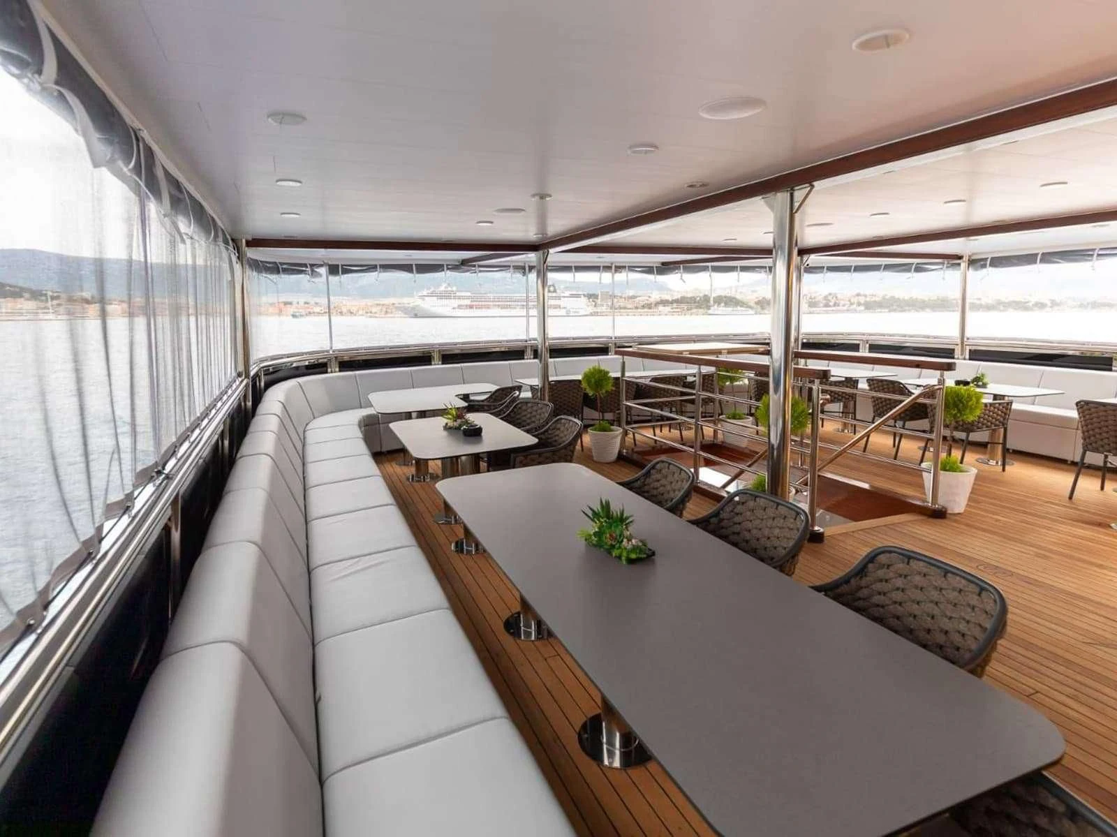 a room with a table and chairs aboard FREEDOM Yacht for Sale