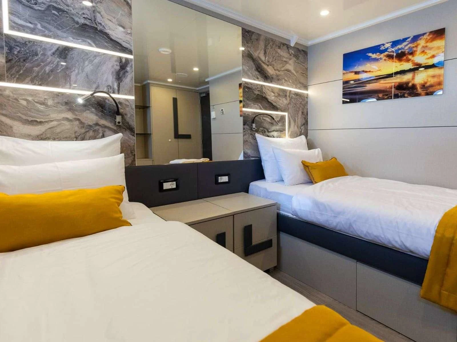 a room with a bed and a television aboard FREEDOM Yacht for Sale