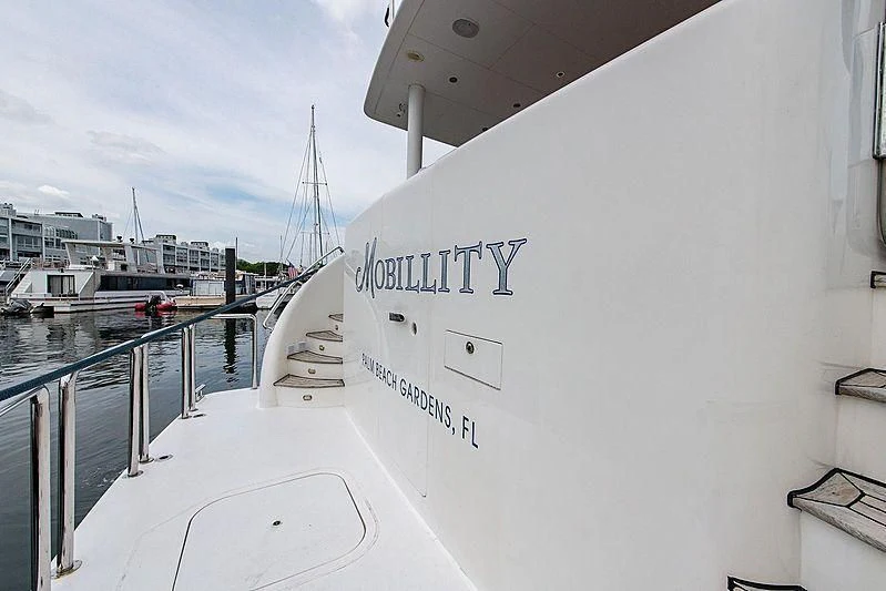 a white wall with a sign on it aboard CIN-TAX Yacht for Sale