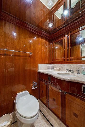 a bathroom with wooden walls aboard CIN-TAX Yacht for Sale