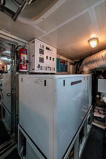 a large refrigerator in a store aboard CIN-TAX Yacht for Sale