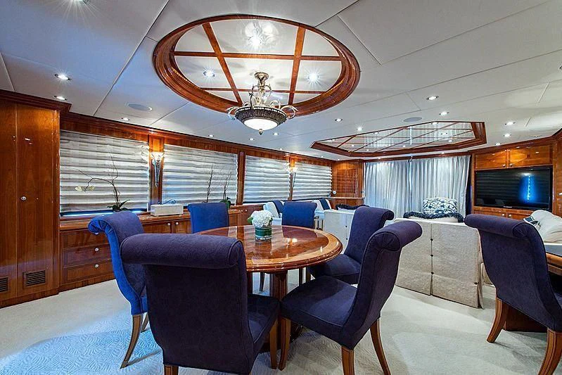 a room with a table and chairs aboard CIN-TAX Yacht for Sale