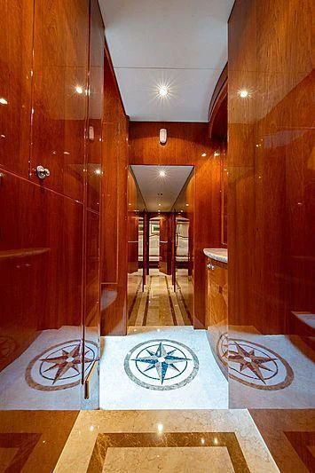 a room with a large mirror aboard CIN-TAX Yacht for Sale