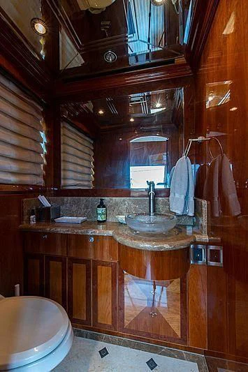 a bathroom with a sink and a mirror aboard CIN-TAX Yacht for Sale