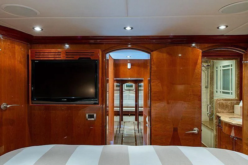 a bathroom with a tv and a bathtub aboard CIN-TAX Yacht for Sale