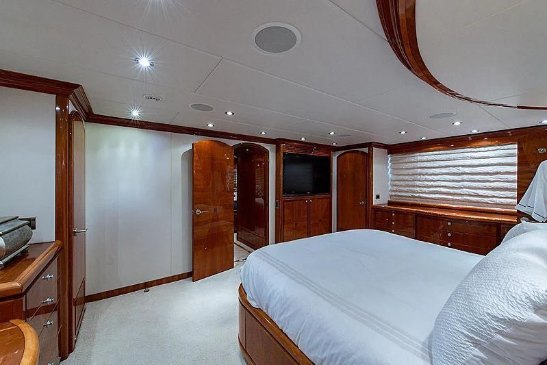 a room with a bed and a wood door aboard CIN-TAX Yacht for Sale