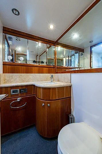 a bathroom with a large mirror aboard CIN-TAX Yacht for Sale