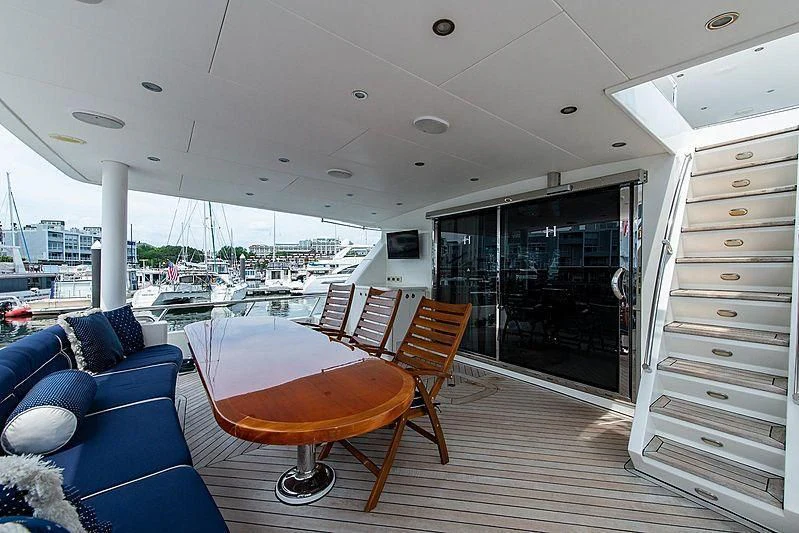 a room with a table and chairs aboard CIN-TAX Yacht for Sale