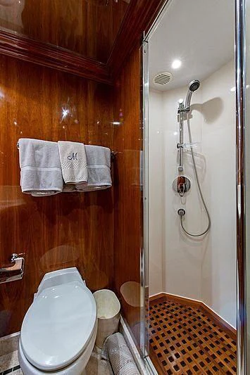 a bathroom with a toilet and a shower aboard CIN-TAX Yacht for Sale