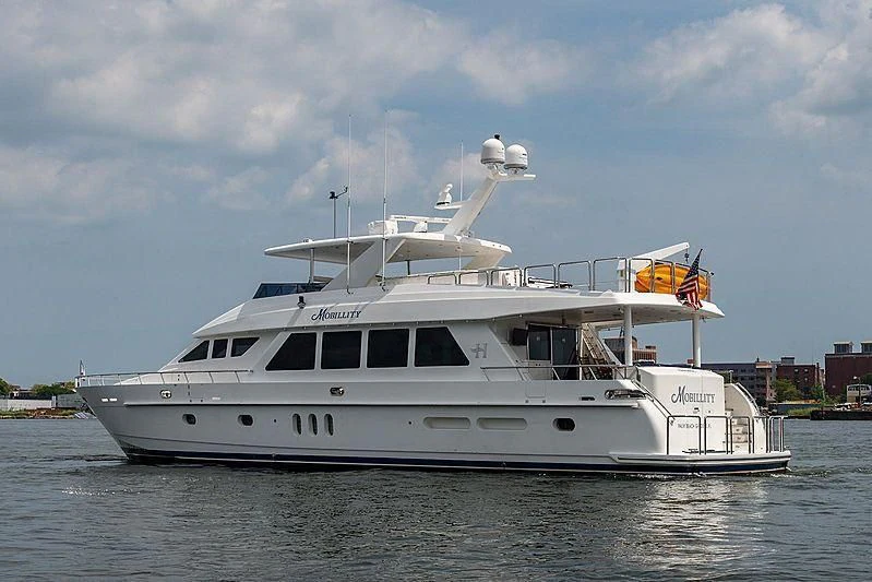 a large white boat on the water aboard CIN-TAX Yacht for Sale