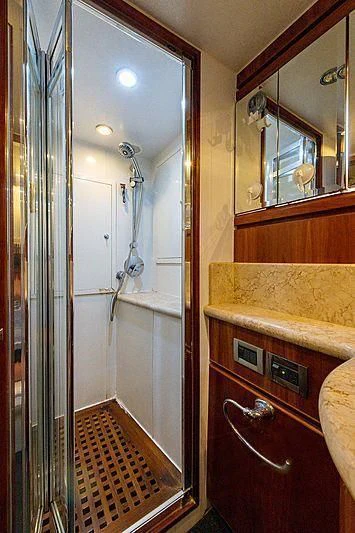 a bathroom with a sink and a mirror aboard CIN-TAX Yacht for Sale