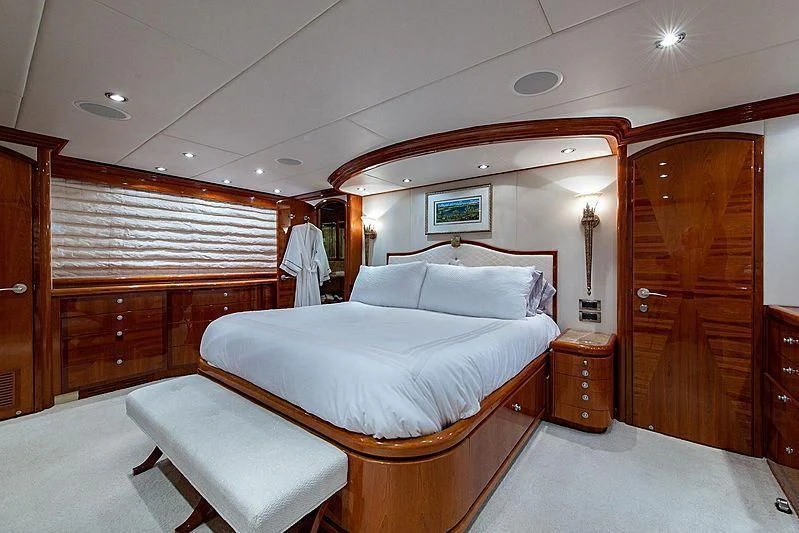 a room with a bed and a wood door aboard CIN-TAX Yacht for Sale