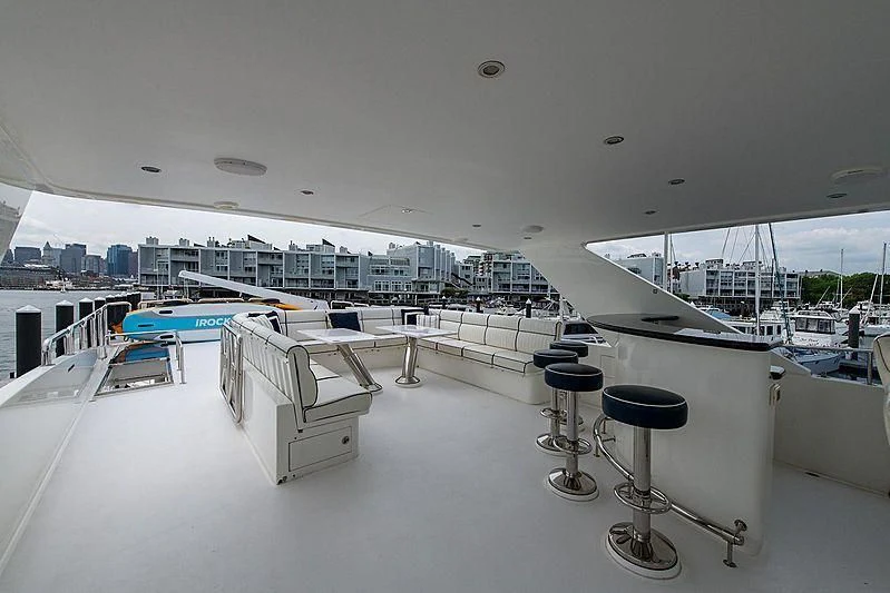 a room with a table and chairs aboard CIN-TAX Yacht for Sale