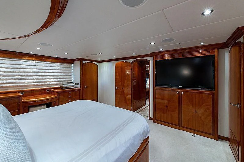 a bedroom with a bed and tv aboard CIN-TAX Yacht for Sale