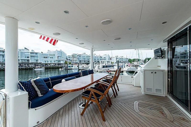 a room with a table and chairs aboard CIN-TAX Yacht for Sale