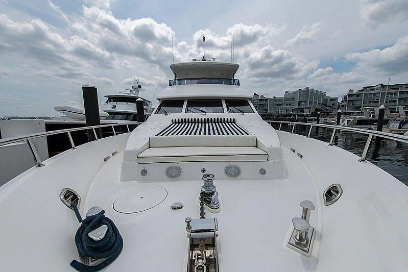 a white boat on a deck aboard CIN-TAX Yacht for Sale