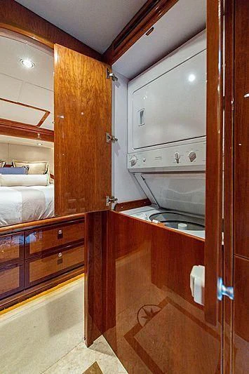 a kitchen with wooden cabinets aboard CIN-TAX Yacht for Sale