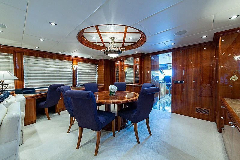 a room with a table and chairs aboard CIN-TAX Yacht for Sale