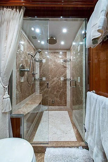 a bathroom with a shower and a sink aboard CIN-TAX Yacht for Sale