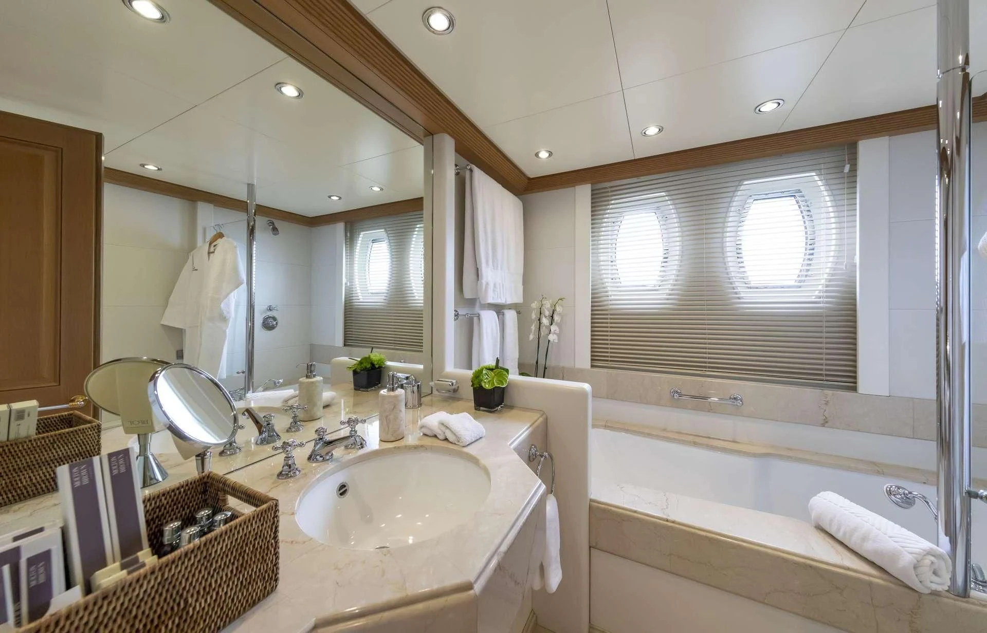 a bathroom with a sink and bathtub aboard MARLA Yacht for Sale