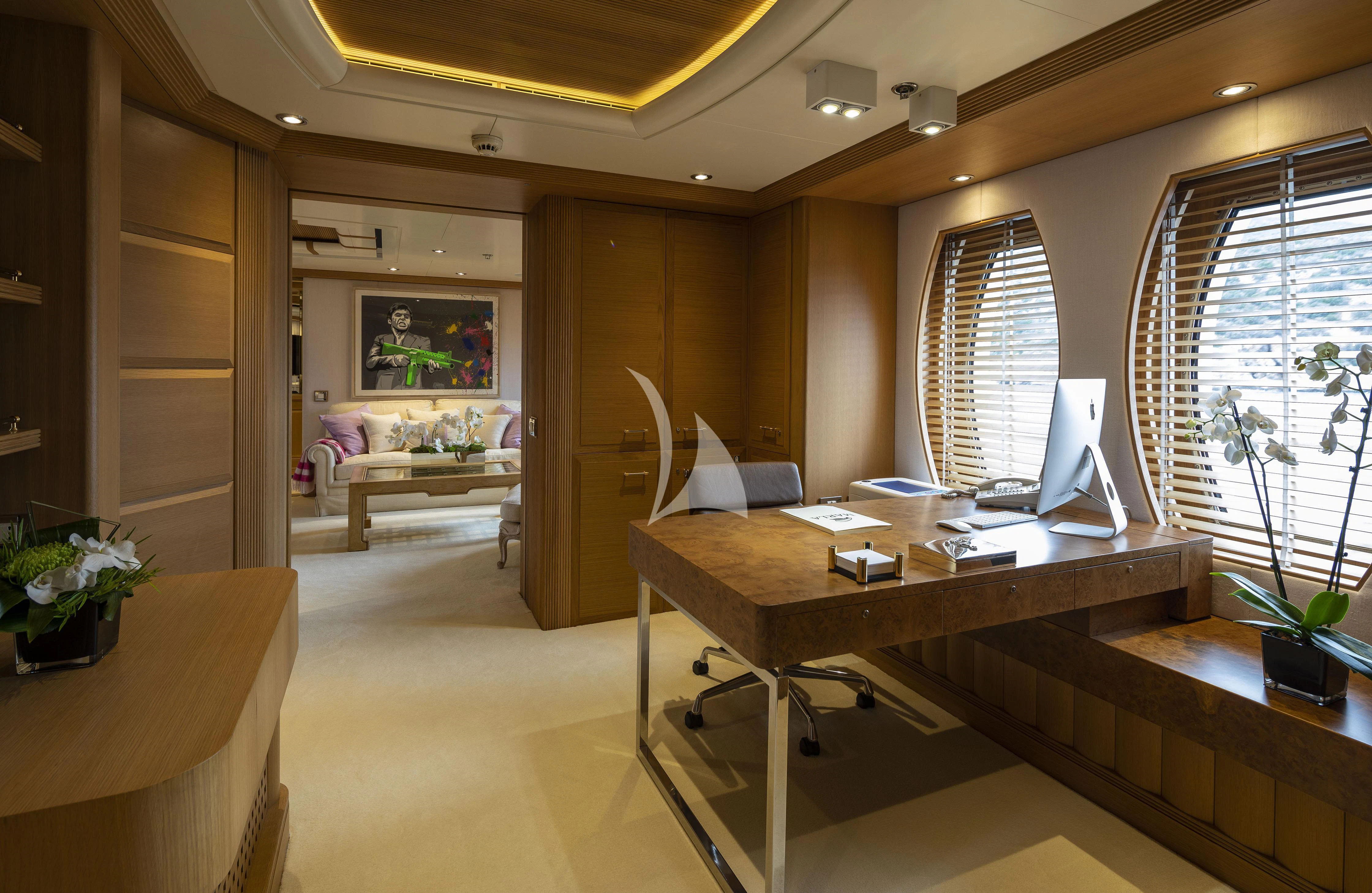 a room with a desk and a chair aboard MARLA Yacht for Sale