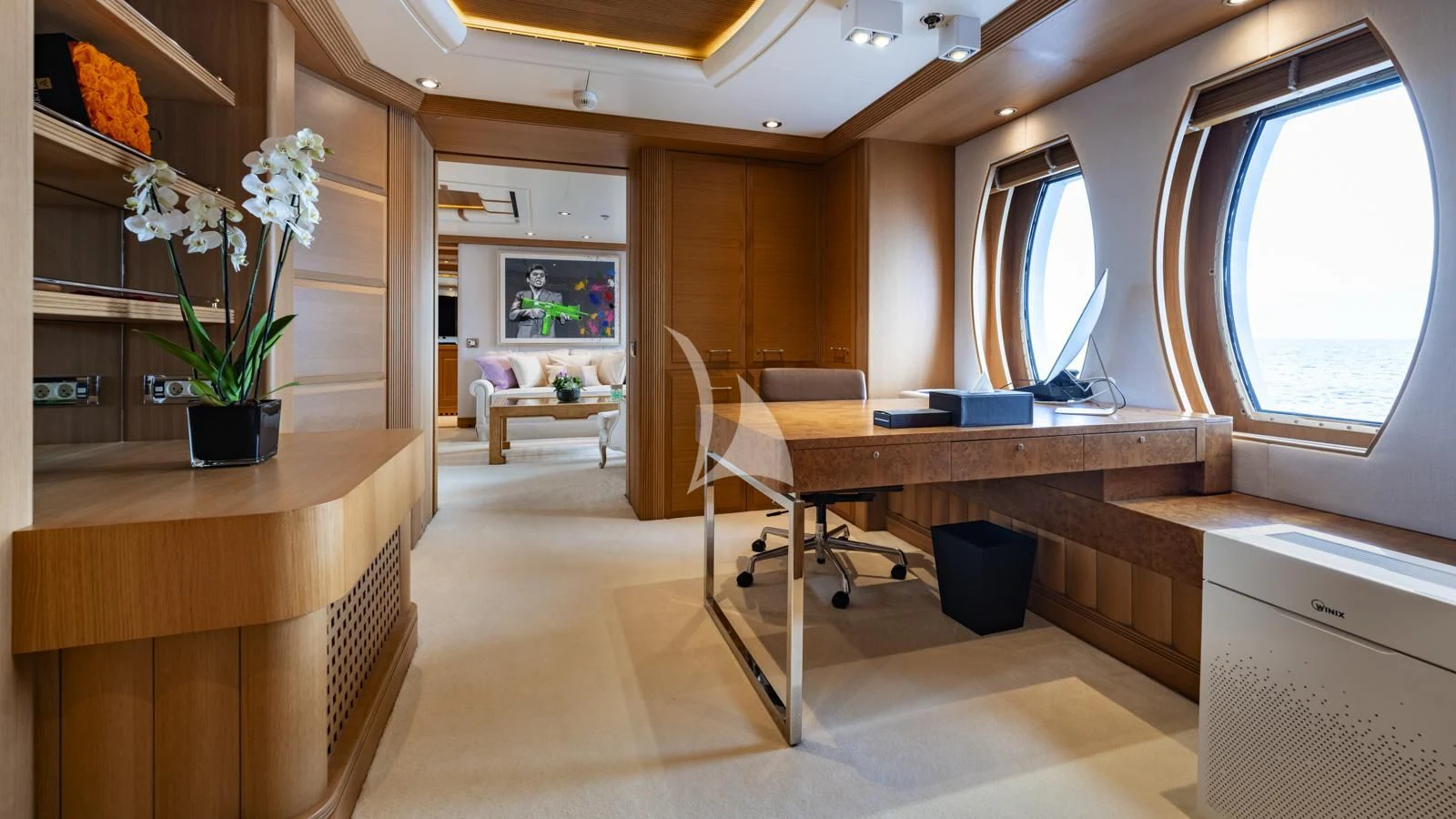 a room with a table and chairs aboard MARLA Yacht for Sale