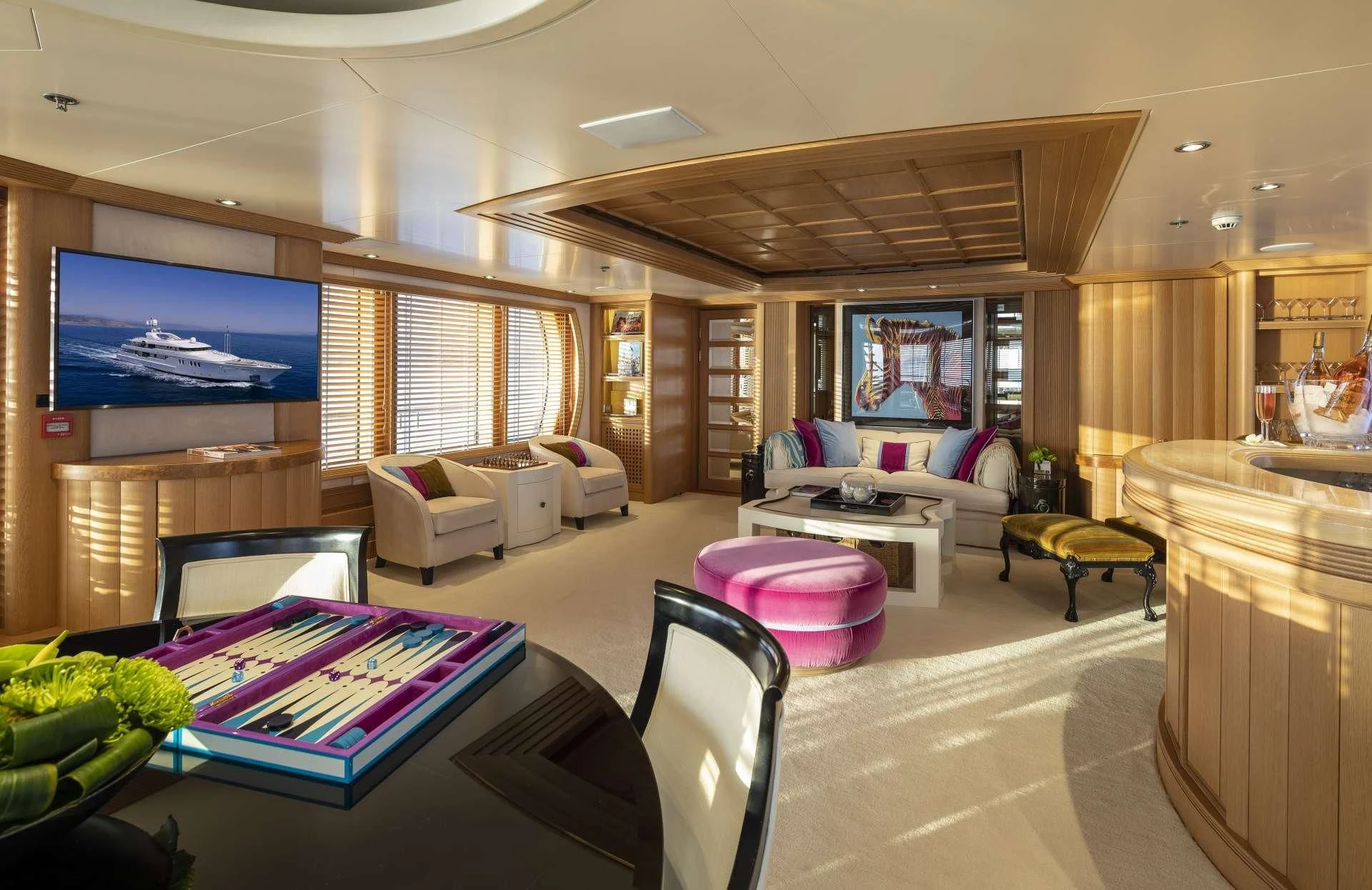 a living room with a large screen aboard MARLA Yacht for Sale