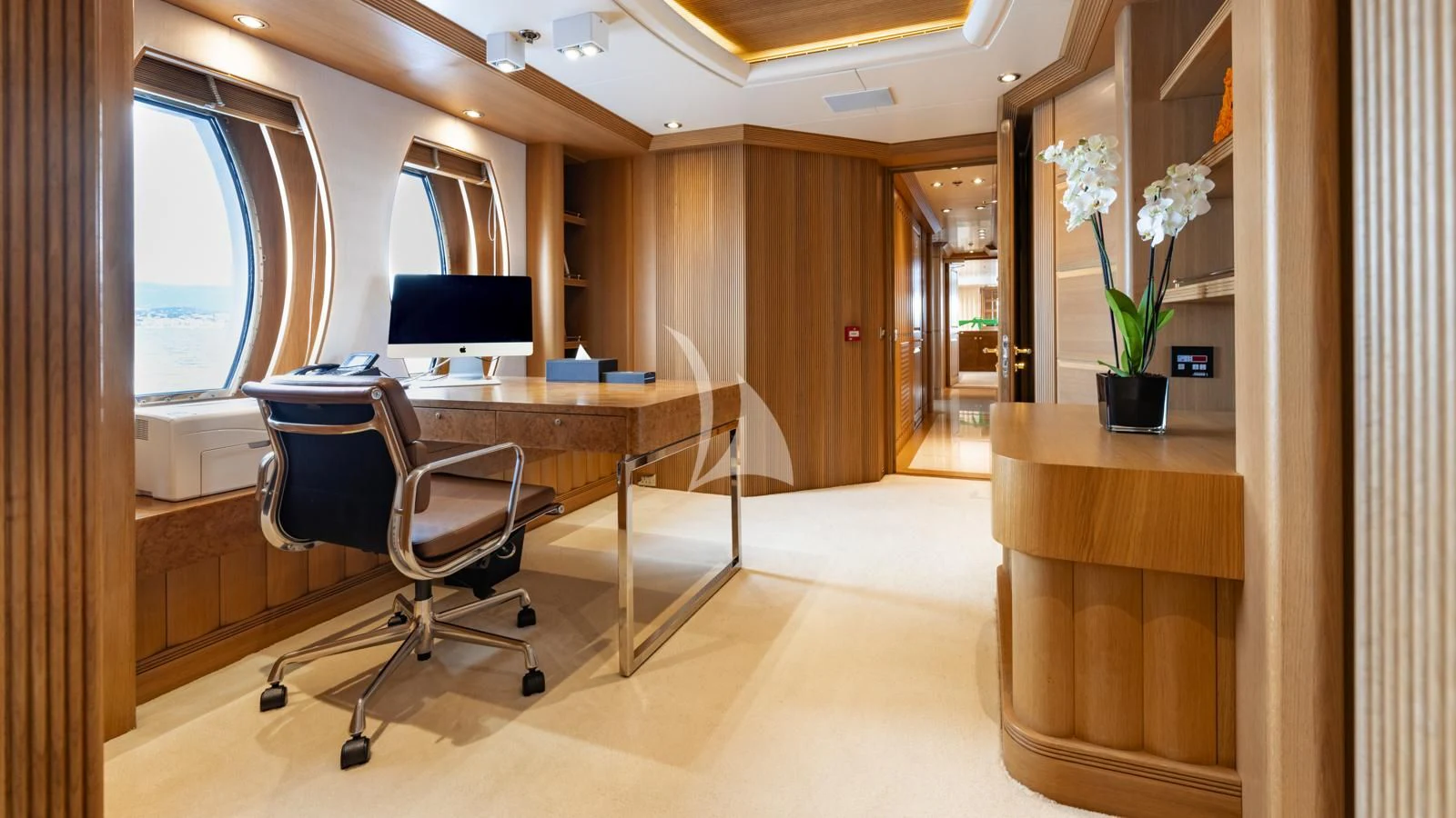 a room with a table and chairs aboard MARLA Yacht for Sale