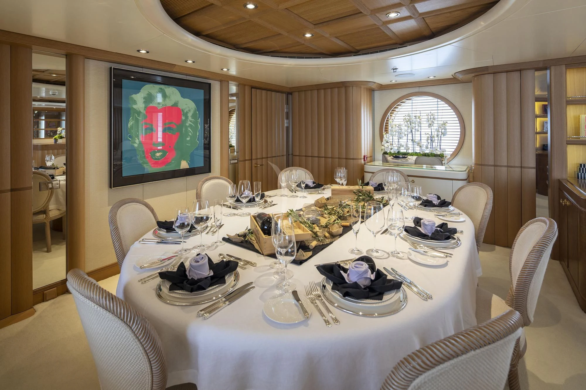 a dining room with a table set for a dinner aboard MARLA Yacht for Sale