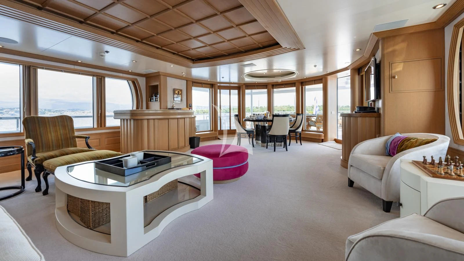 a living room with a table and chairs aboard MARLA Yacht for Sale