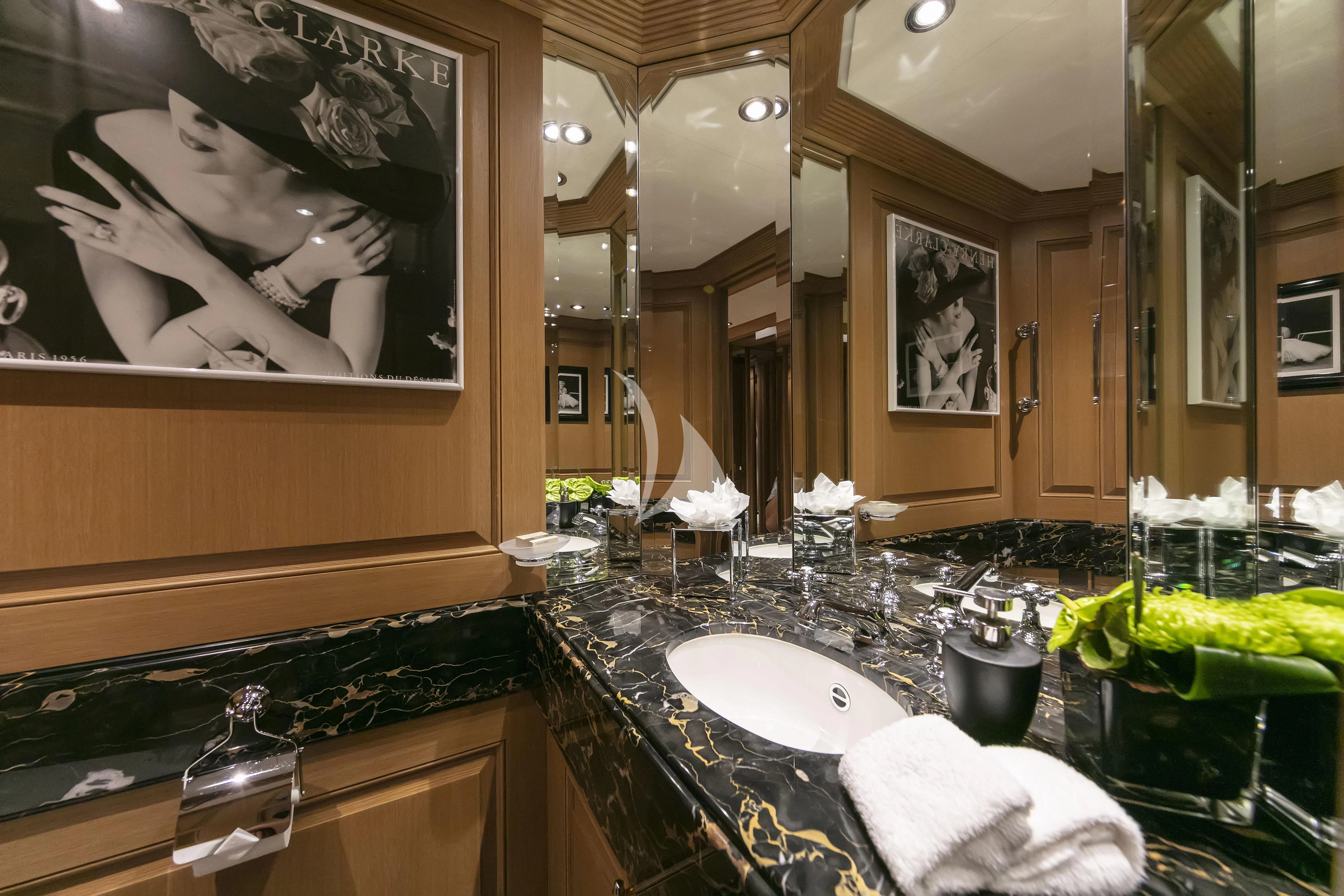 a bathroom with a large mirror aboard MARLA Yacht for Sale