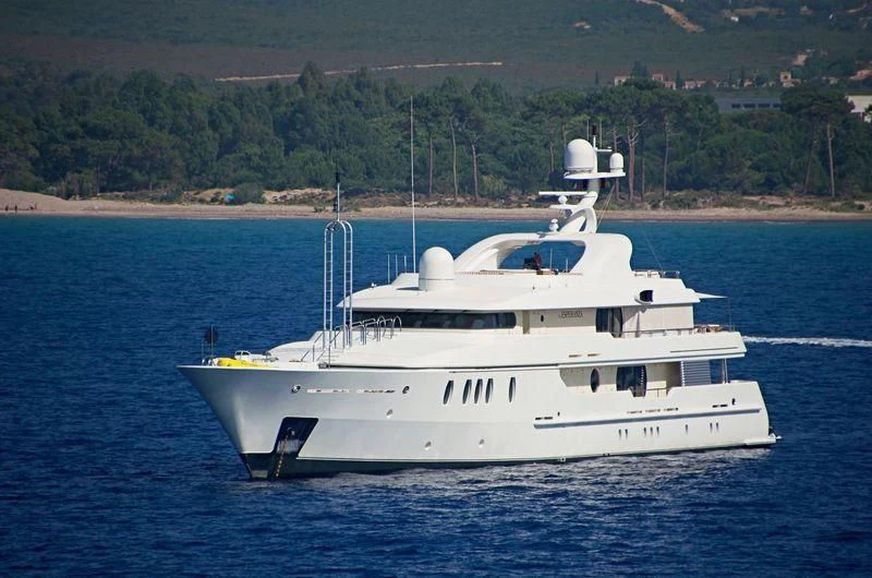 a white boat on the water aboard MARLA Yacht for Sale