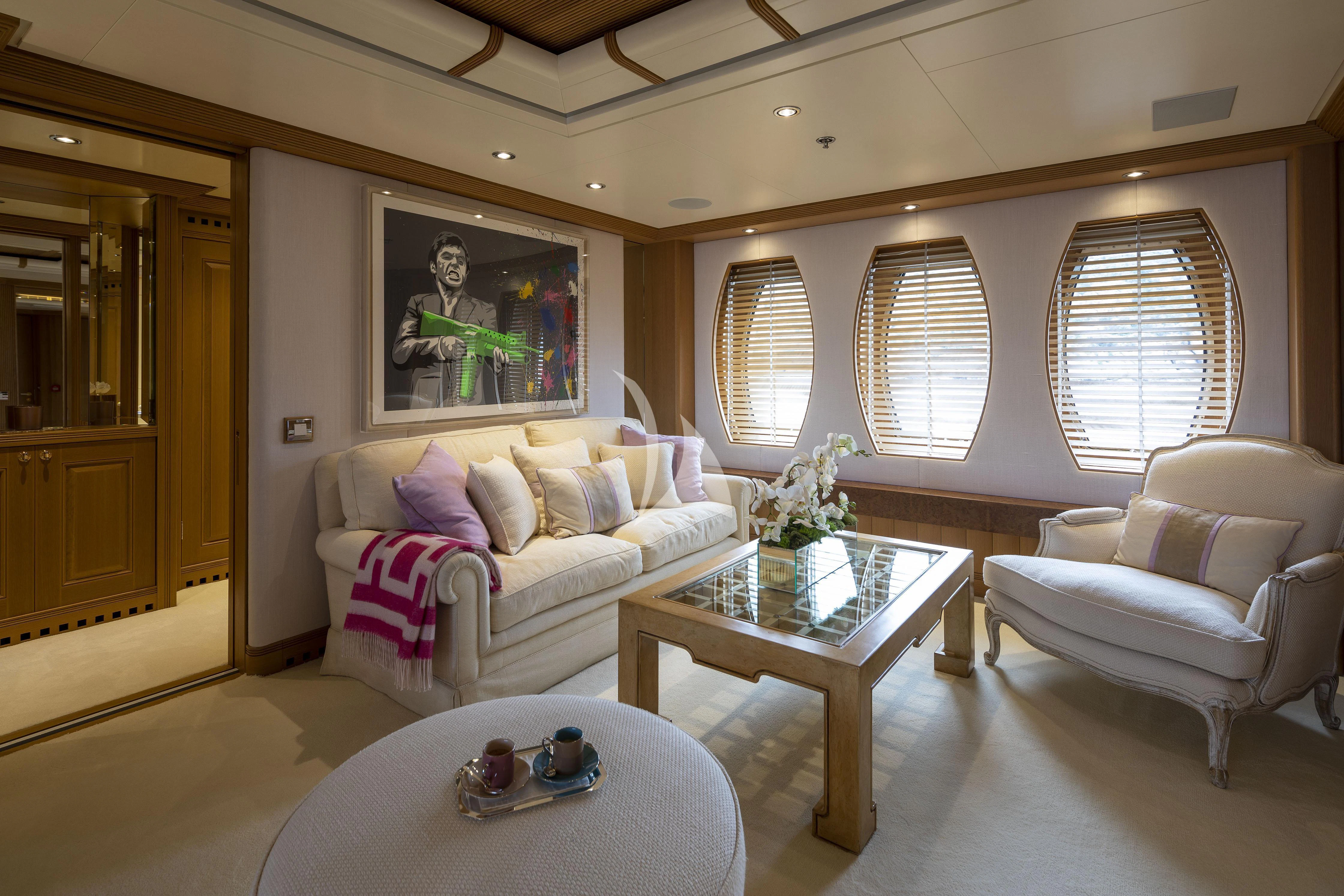 a living room with a couch and a coffee table aboard MARLA Yacht for Sale