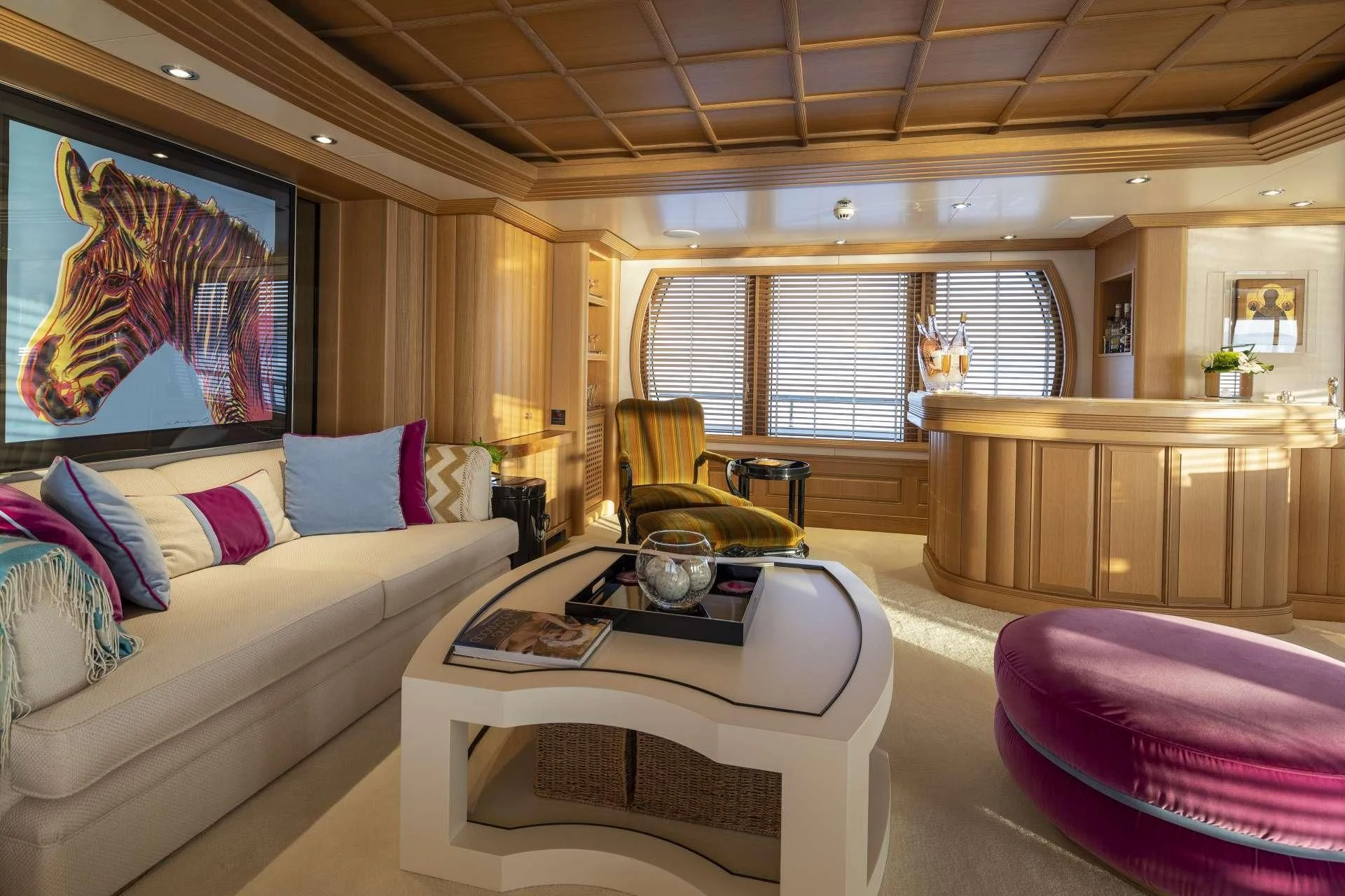 a living room with a couch and a table aboard MARLA Yacht for Sale