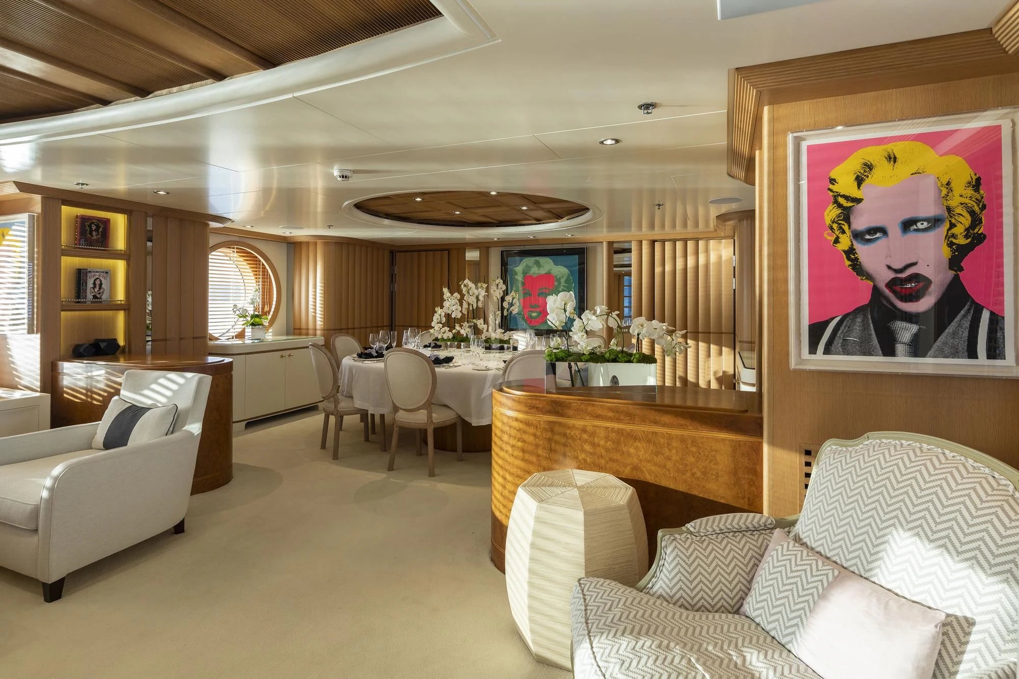 a large living room with a large dining table and chairs aboard MARLA Yacht for Sale
