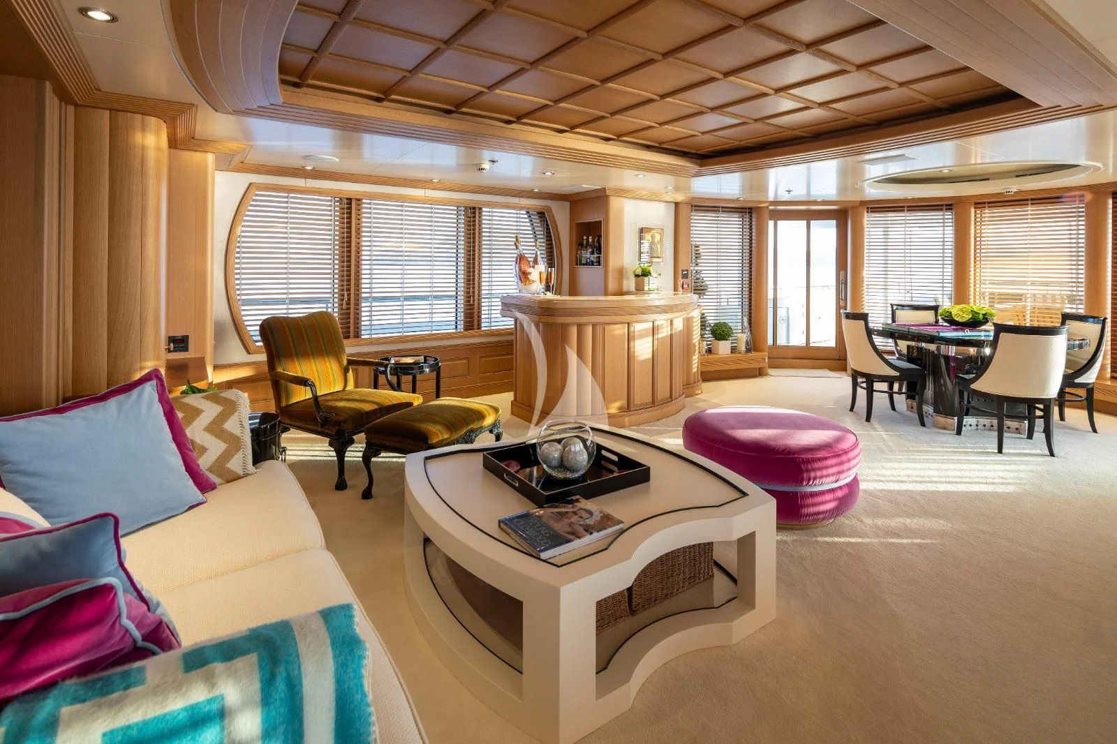 a living room with a table and chairs aboard MARLA Yacht for Sale