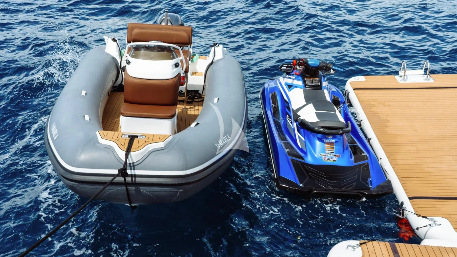 a couple of boats on the water aboard MARLA Yacht for Sale