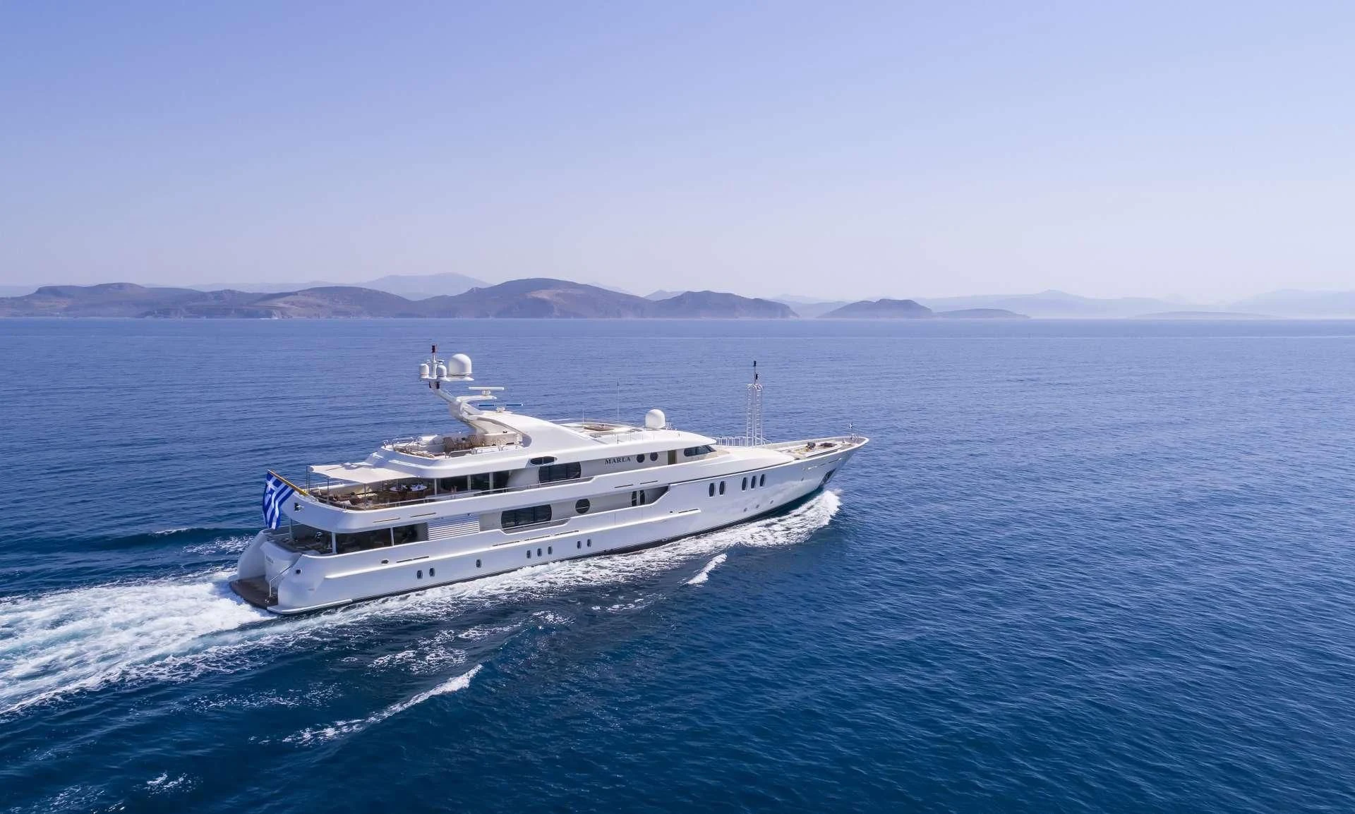 a large white ship in the water aboard MARLA Yacht for Sale