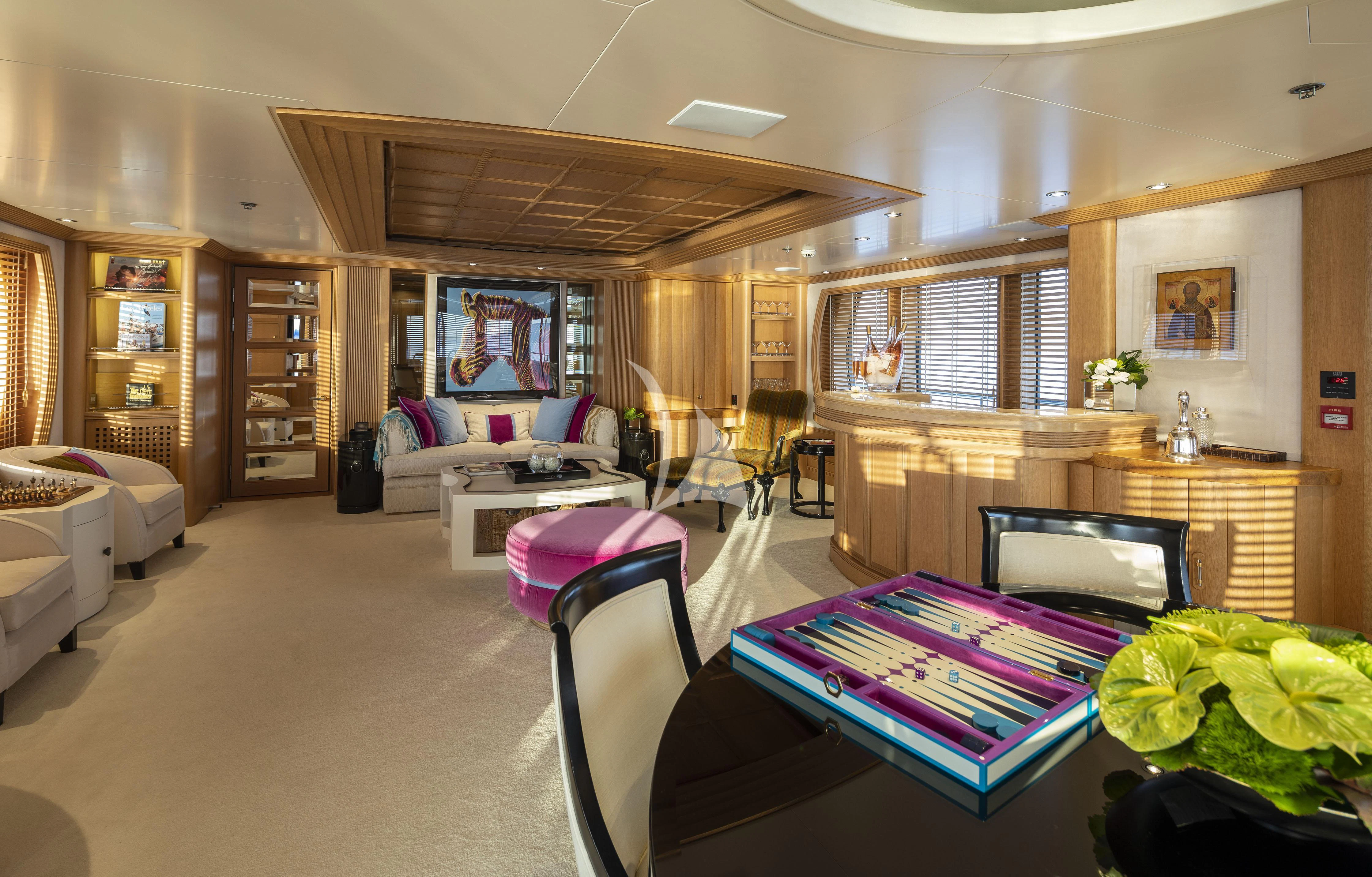 a living room with a large tv aboard MARLA Yacht for Sale