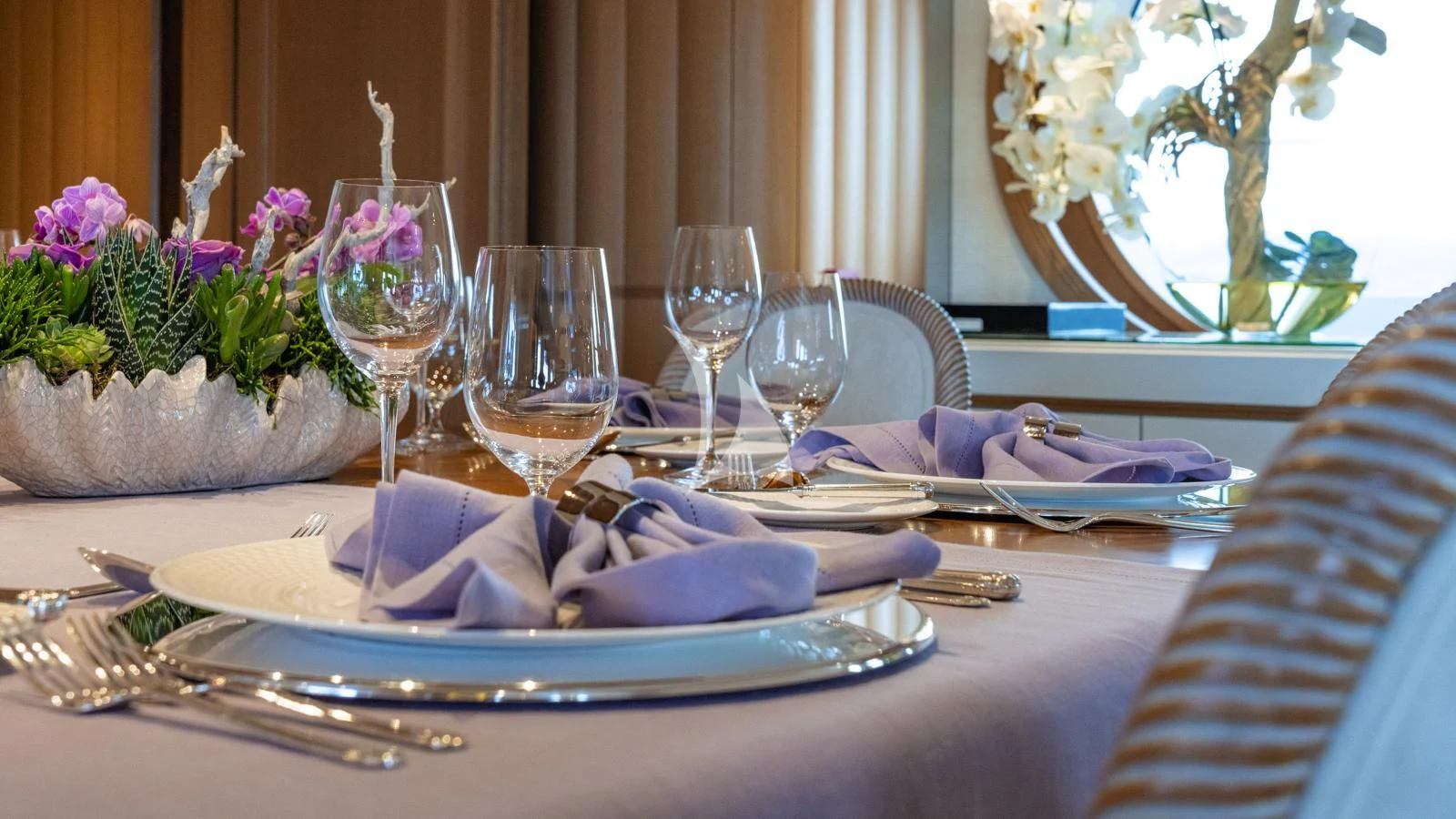 a table with a plate of food and glasses on it aboard MARLA Yacht for Sale